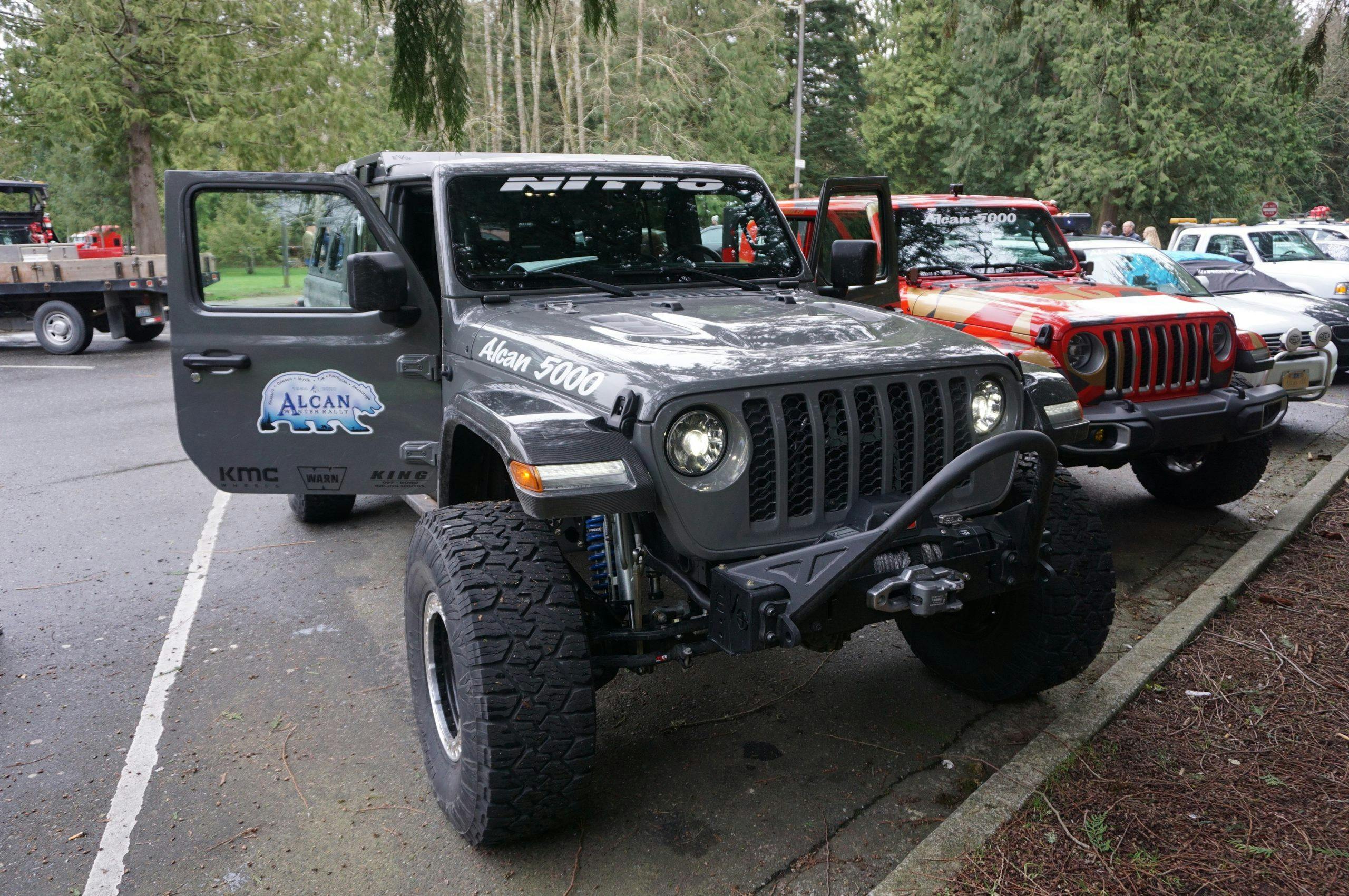 jeep front three-quarter in parking lot for alcan 5000 rally