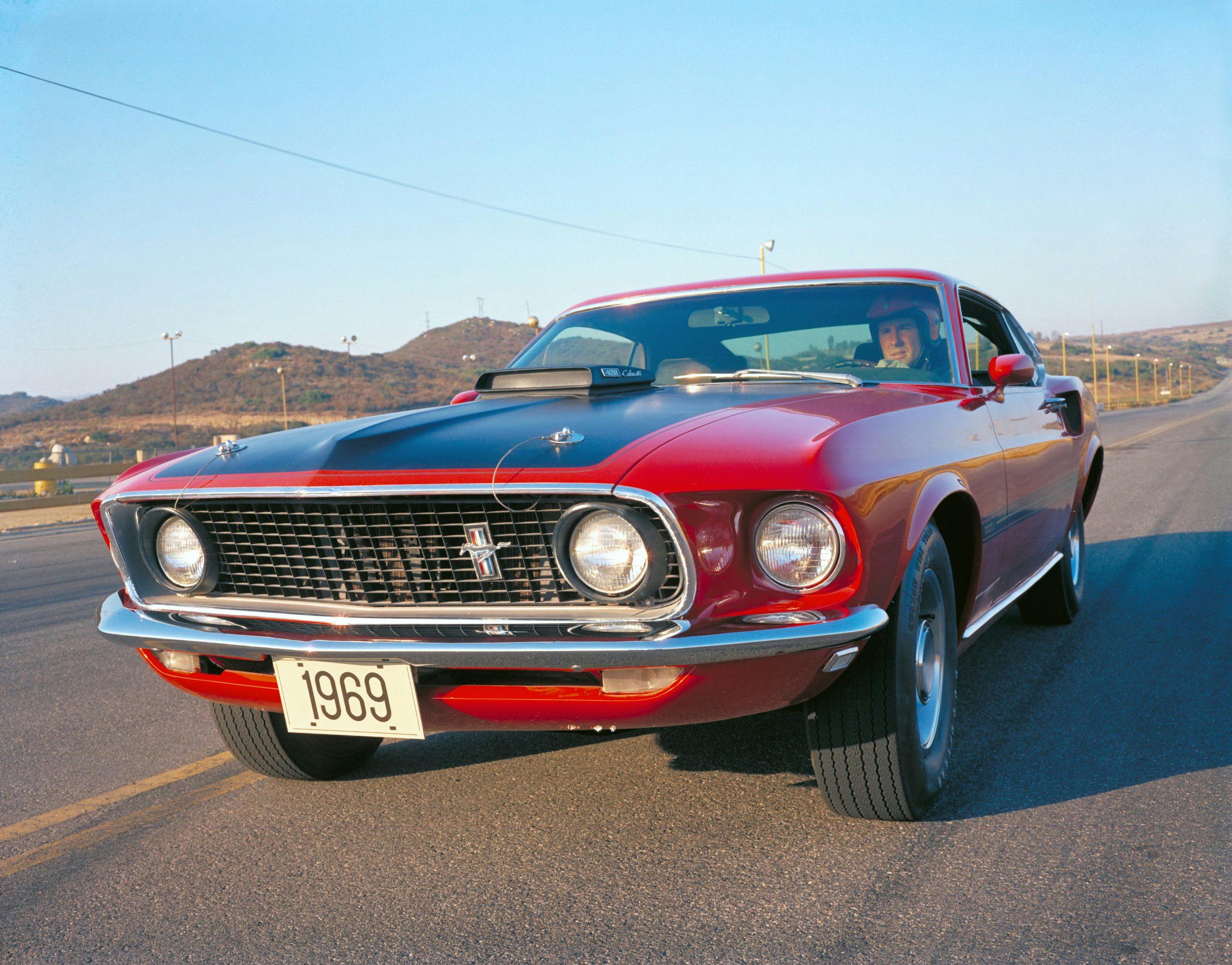 1969 Red Ford Mustang Mach 1 Fastback Front Three-Quarter On Track Action