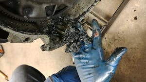gloves covered in oil