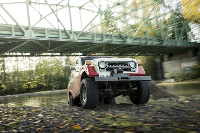 FJ55 Land Cruiser Front Three-Quarter Emerging From River Bed