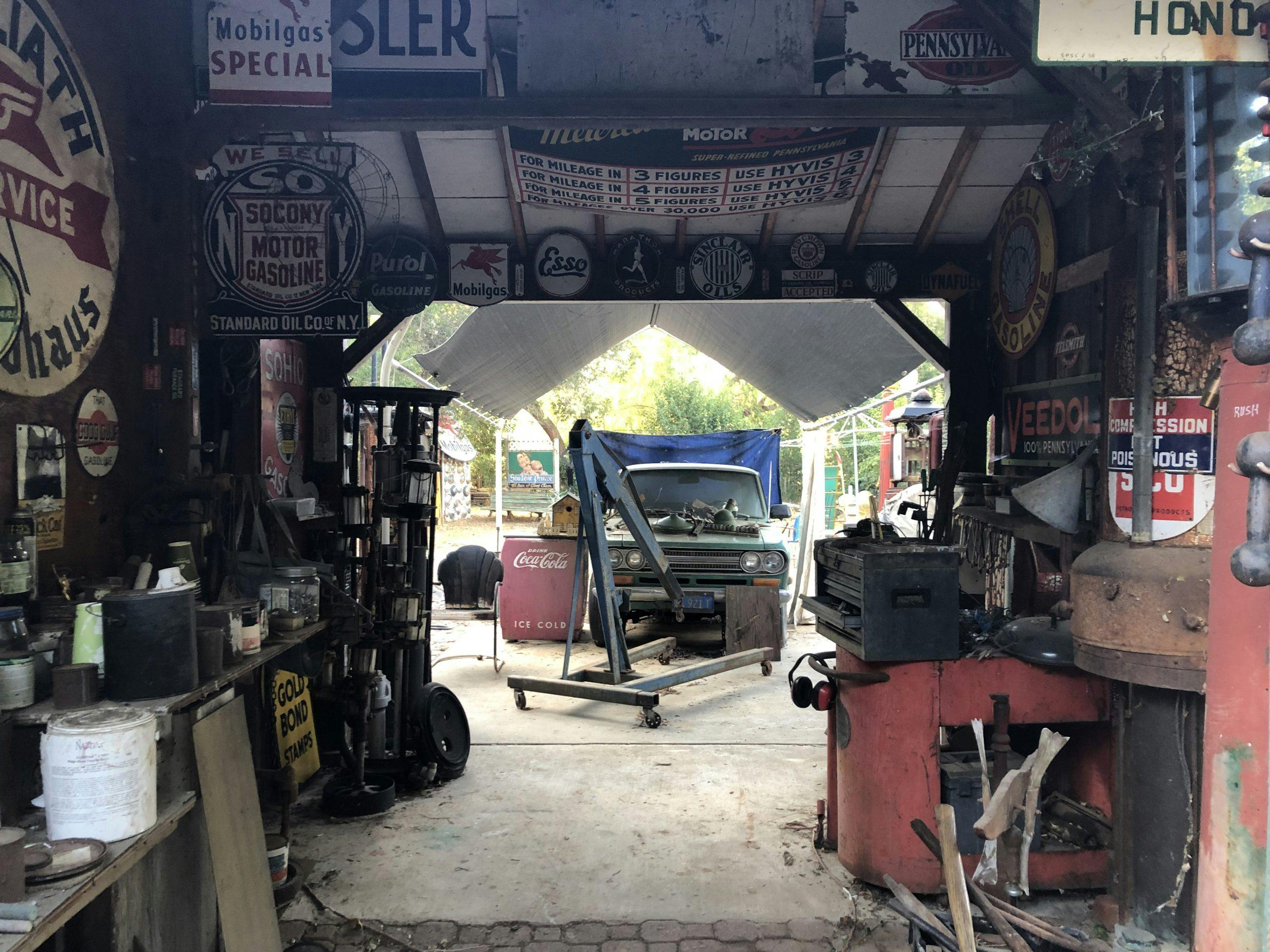 garage filled with vintage gas station sign automobilia