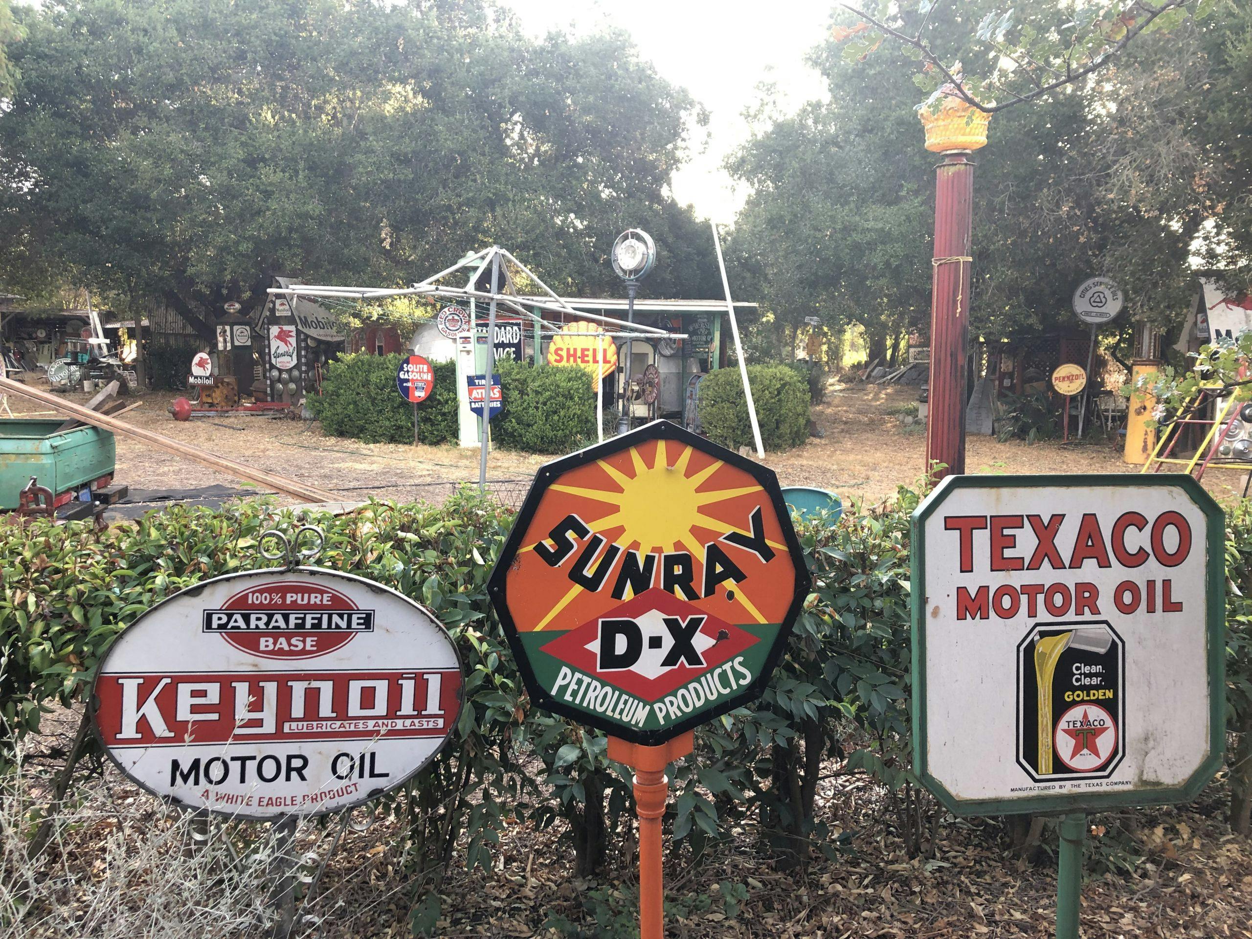 keynoil sunray texaco vintage oil signs in yard