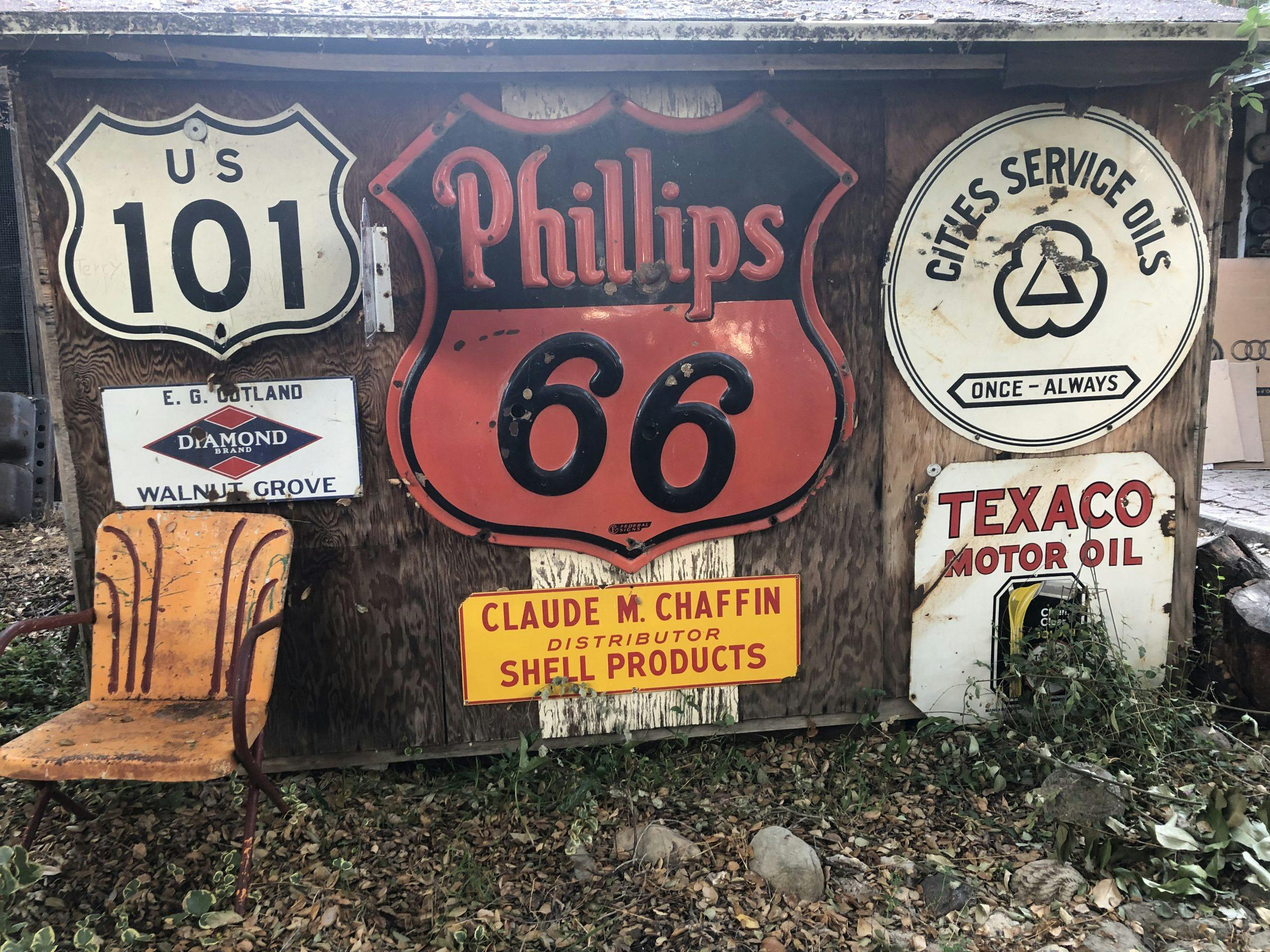 phillips 66 texaco diamond US 101 vintage signs on shed wall