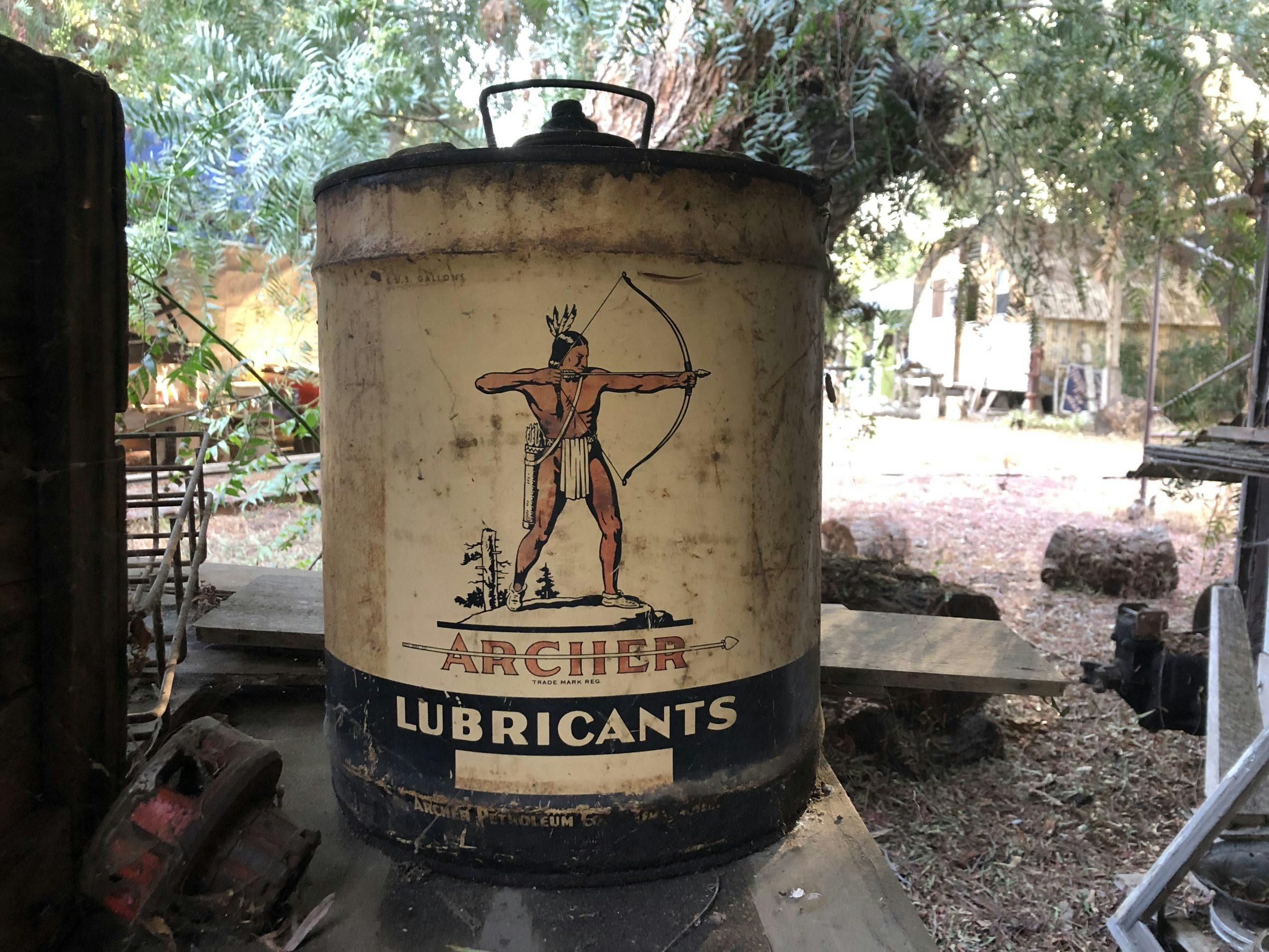 vintage archer lubricants indian arrow graphic on can