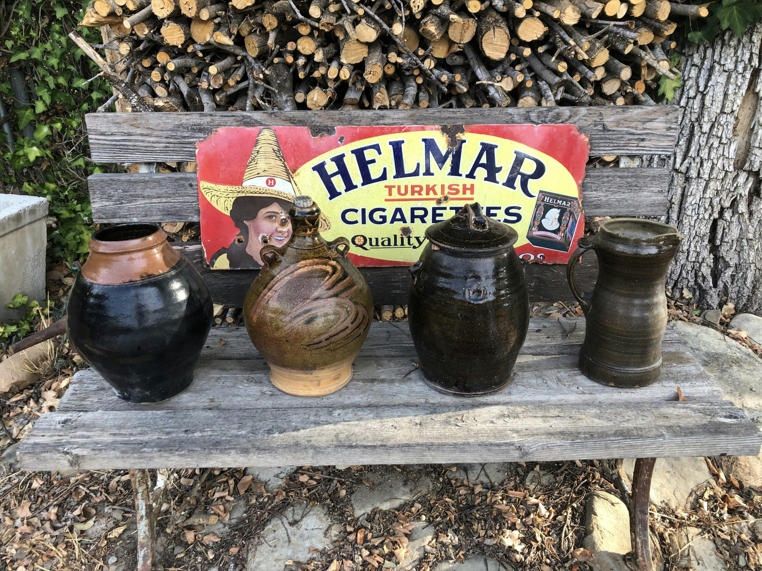 helmar turkish cigarettes sign on bench with antique pots