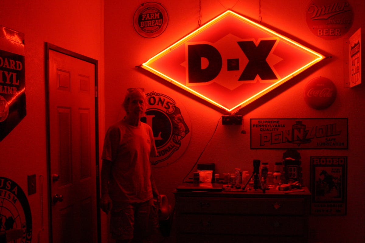 vintage DX red orange neon sign illuminated