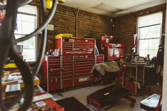 Red Tool Cabinets and Machines in Brick Garage