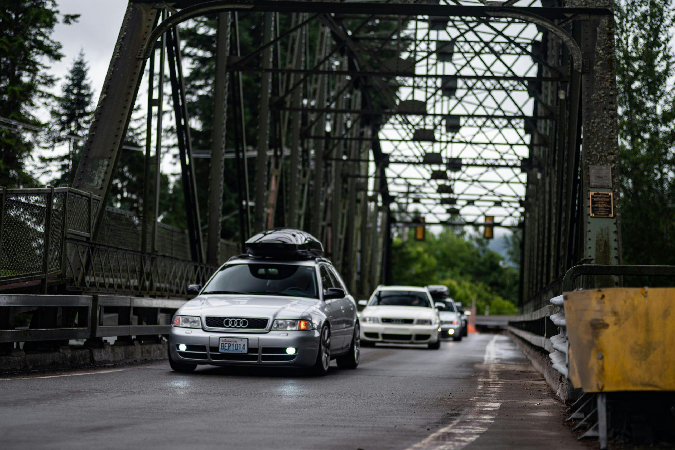 Audi Wagons Bridge Crossing Action Front Three-Quarter