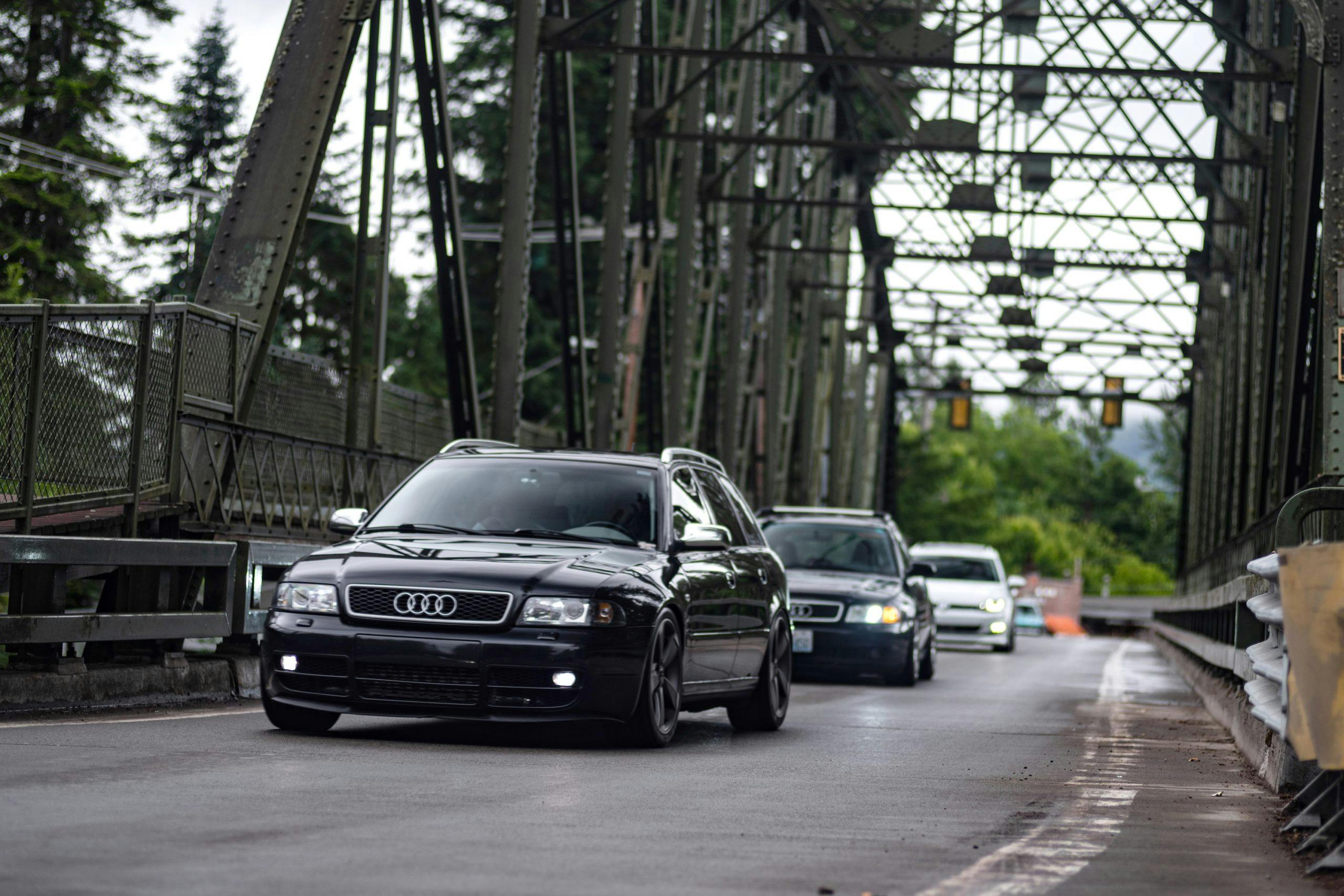 Audi Wagons Bridge Crossing Action Front Three-Quarter