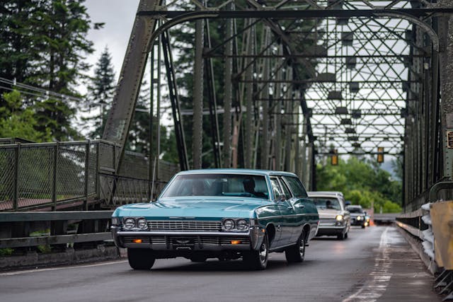 Classic Chevrolet Wagon On Road Action Front Three-Quarter