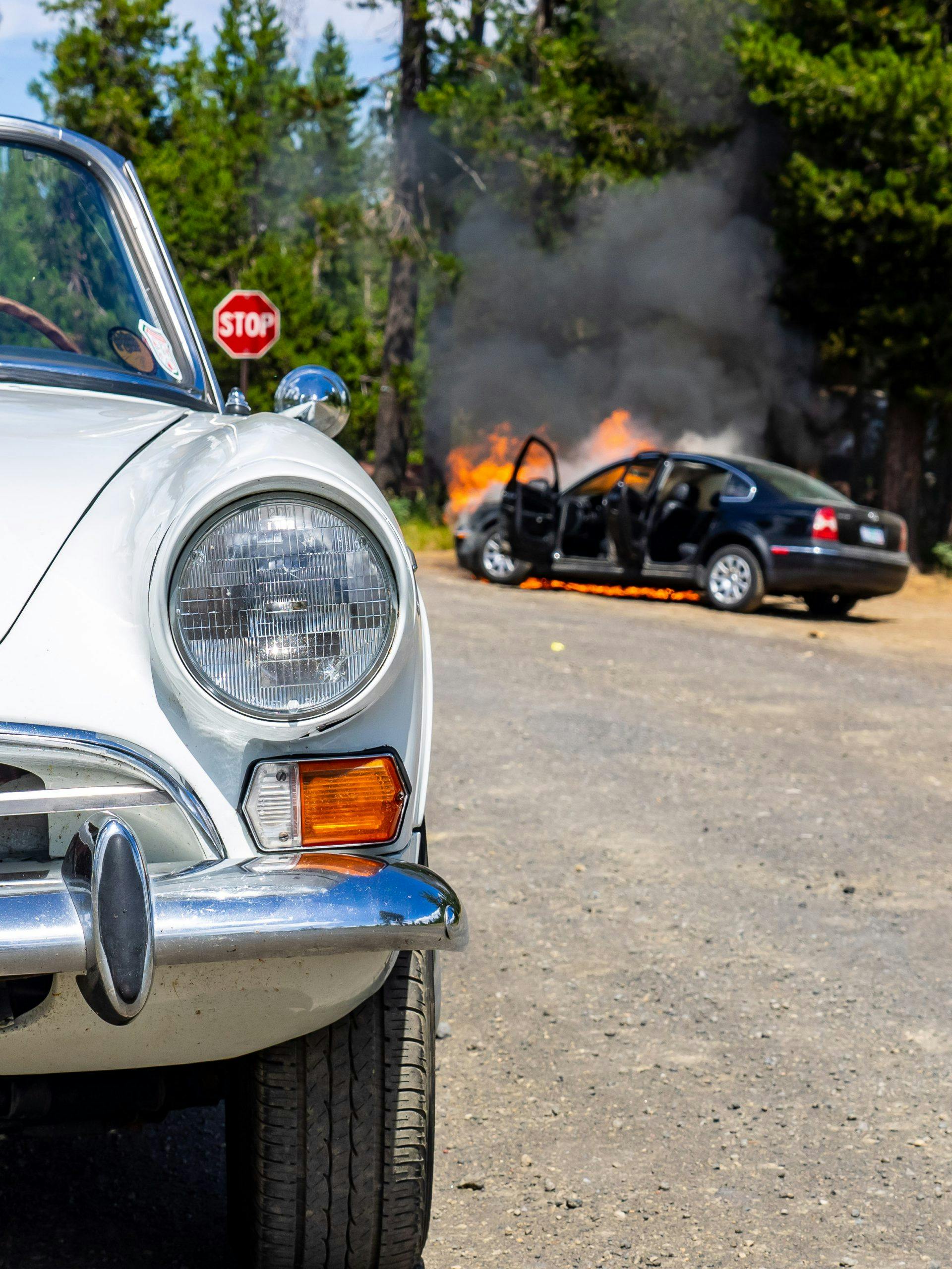 Sunbeam Tiger and Burning VW Passat