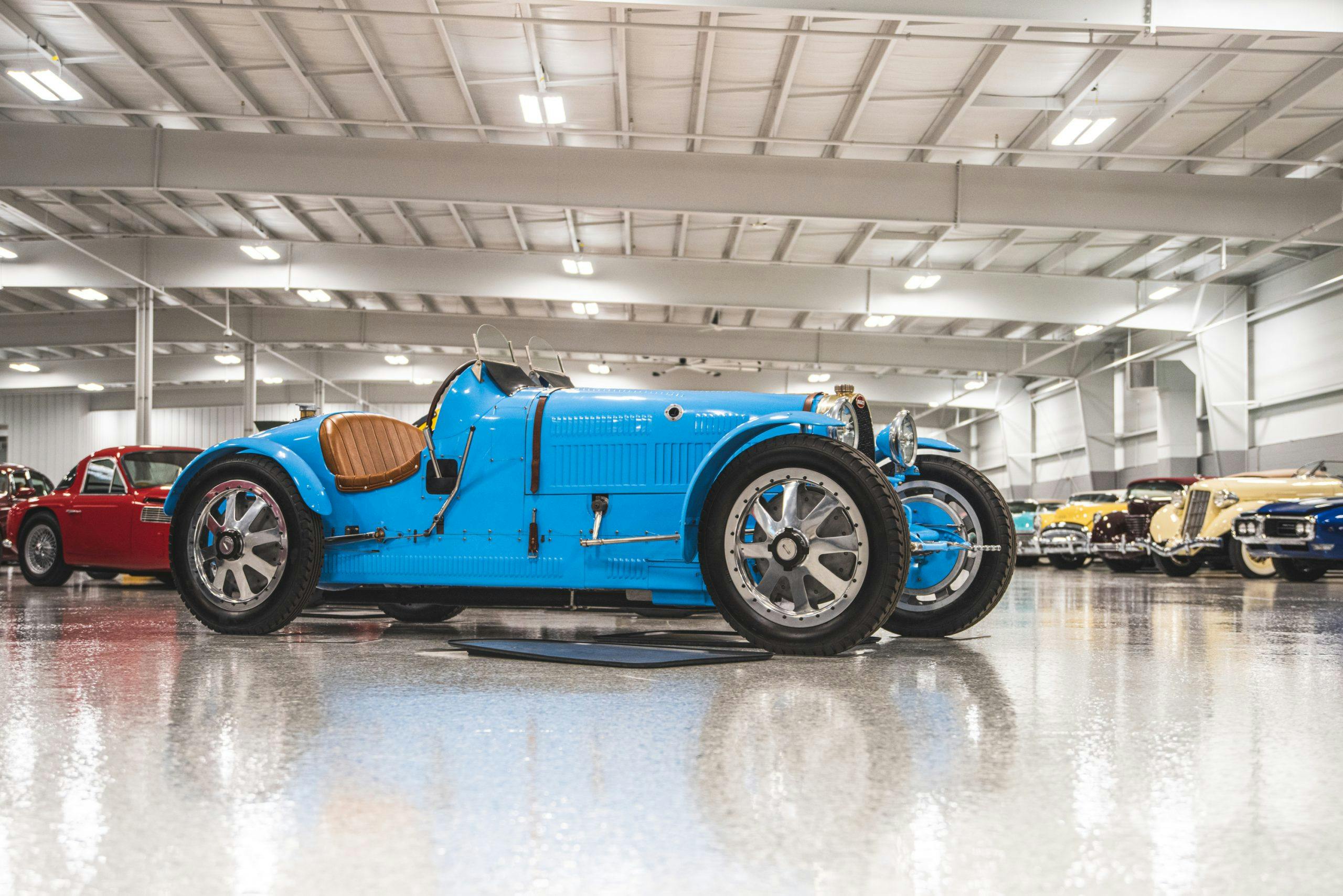 blue vintage bugatti roadster front three-quarter