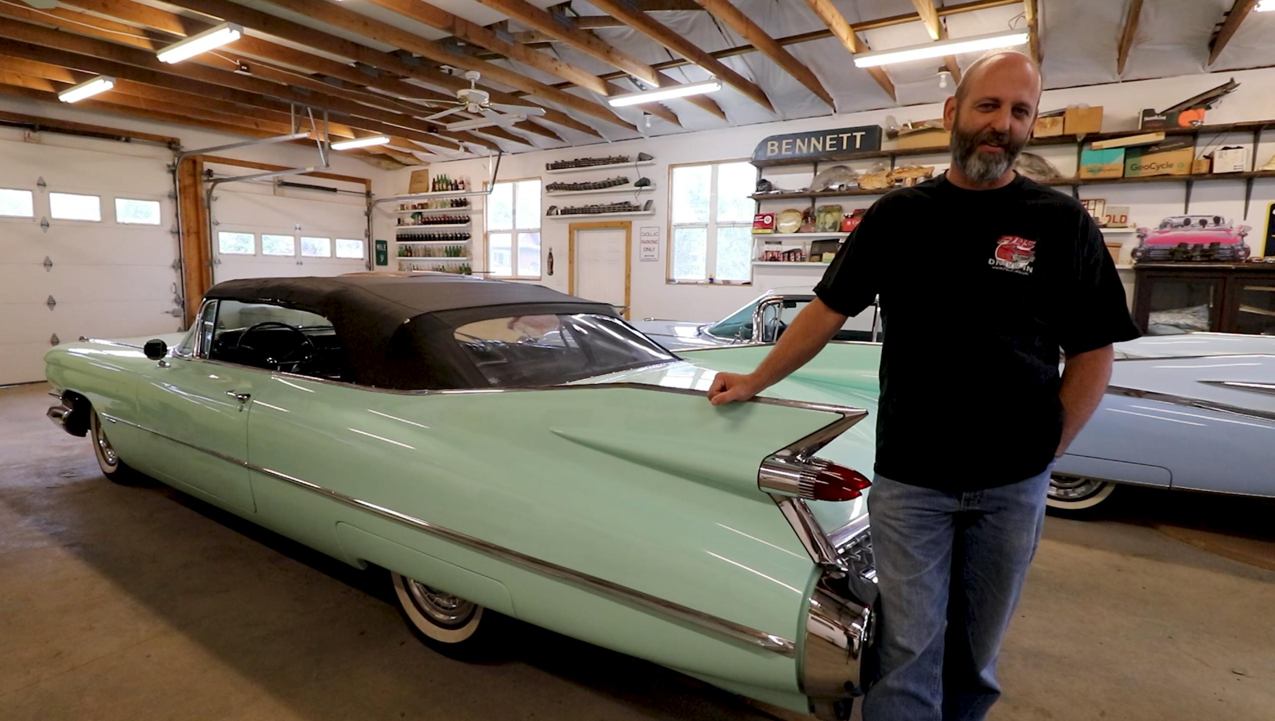 Dan Morehouse with old vintage cadillac in garage