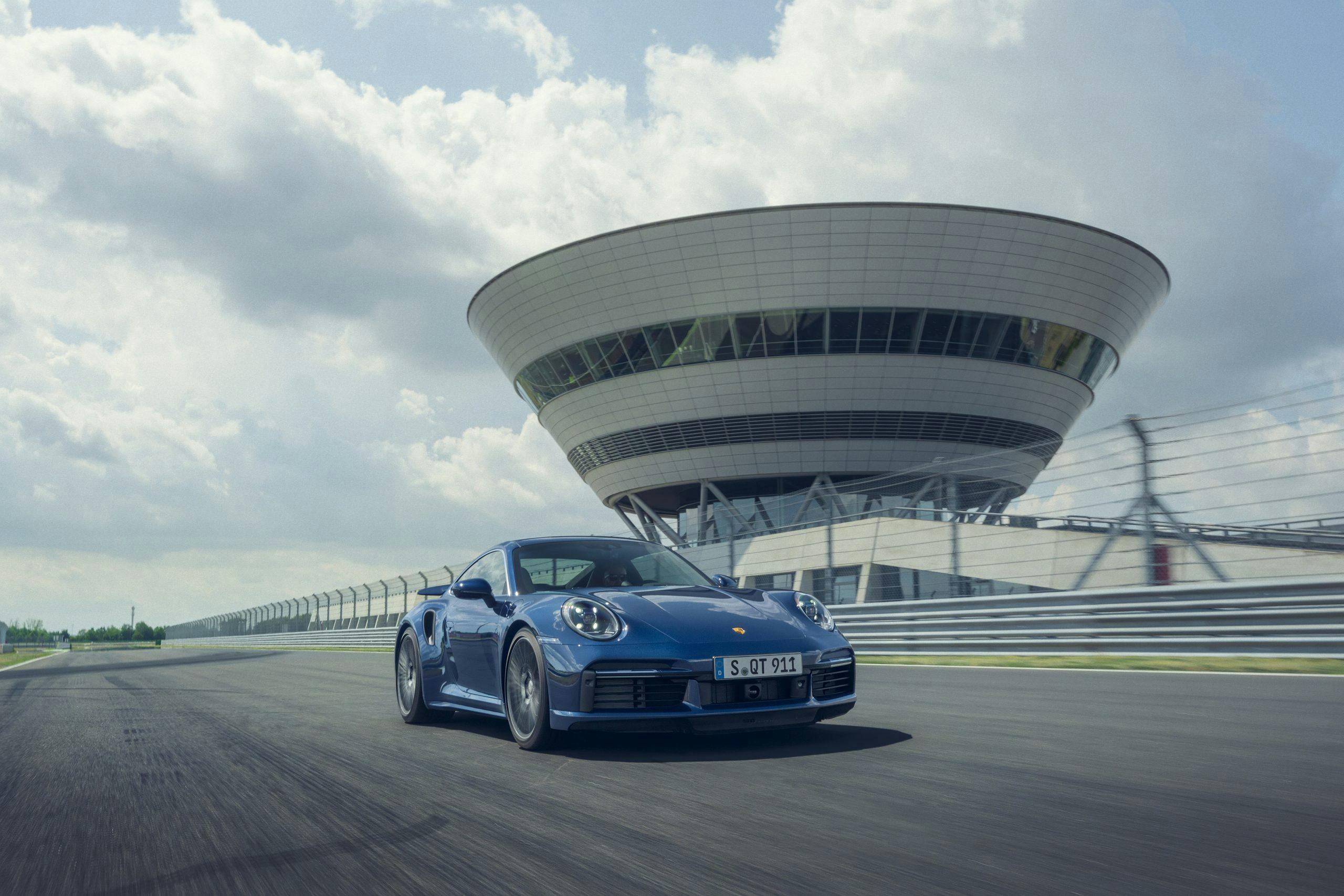 2021 Porsche 911 Turbo on track action front three-quarter