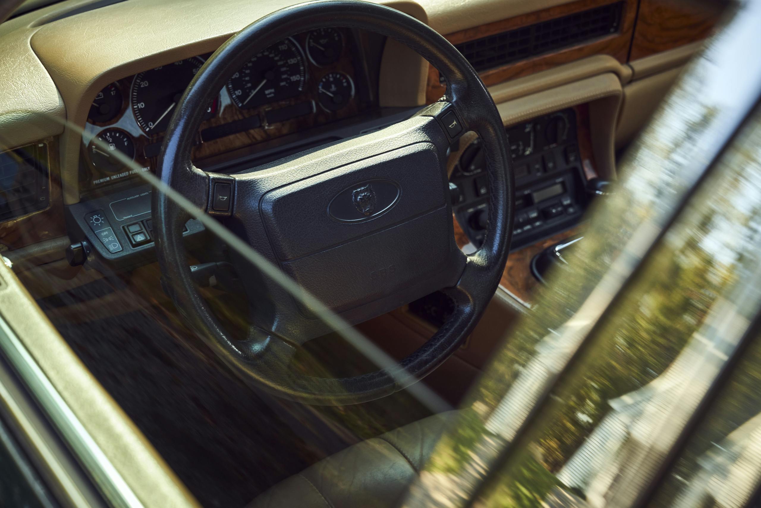 Jaguar XJ6 steering wheel through lowered window