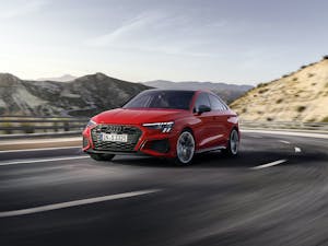 Audi S3 Sedan tango red front three-quarter