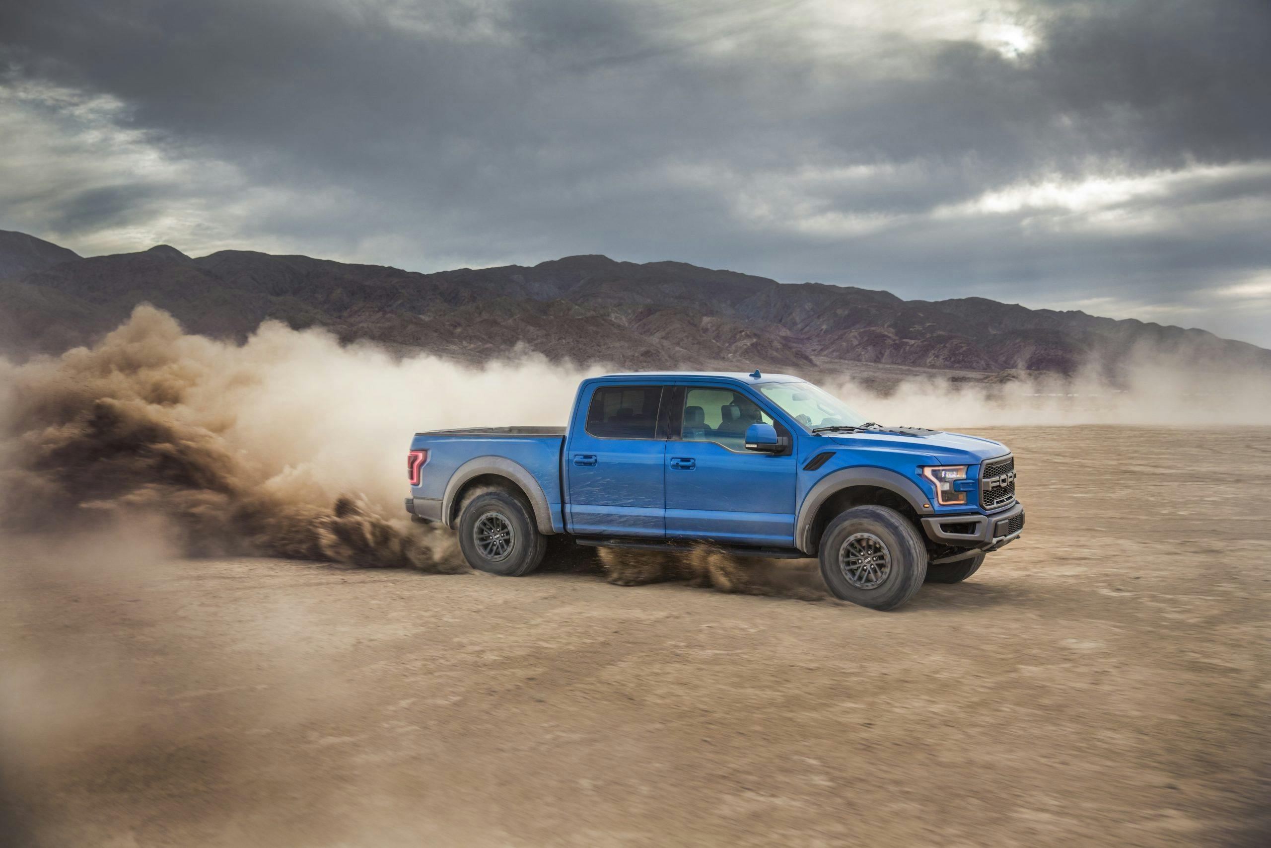 2019 Ford Raptor side profile slinging dirt