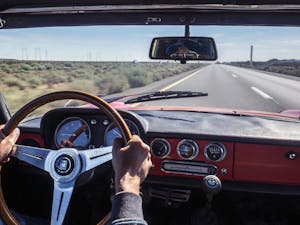 leslie yuen driving his vintage 1967 alfa romeo duetto on interstate