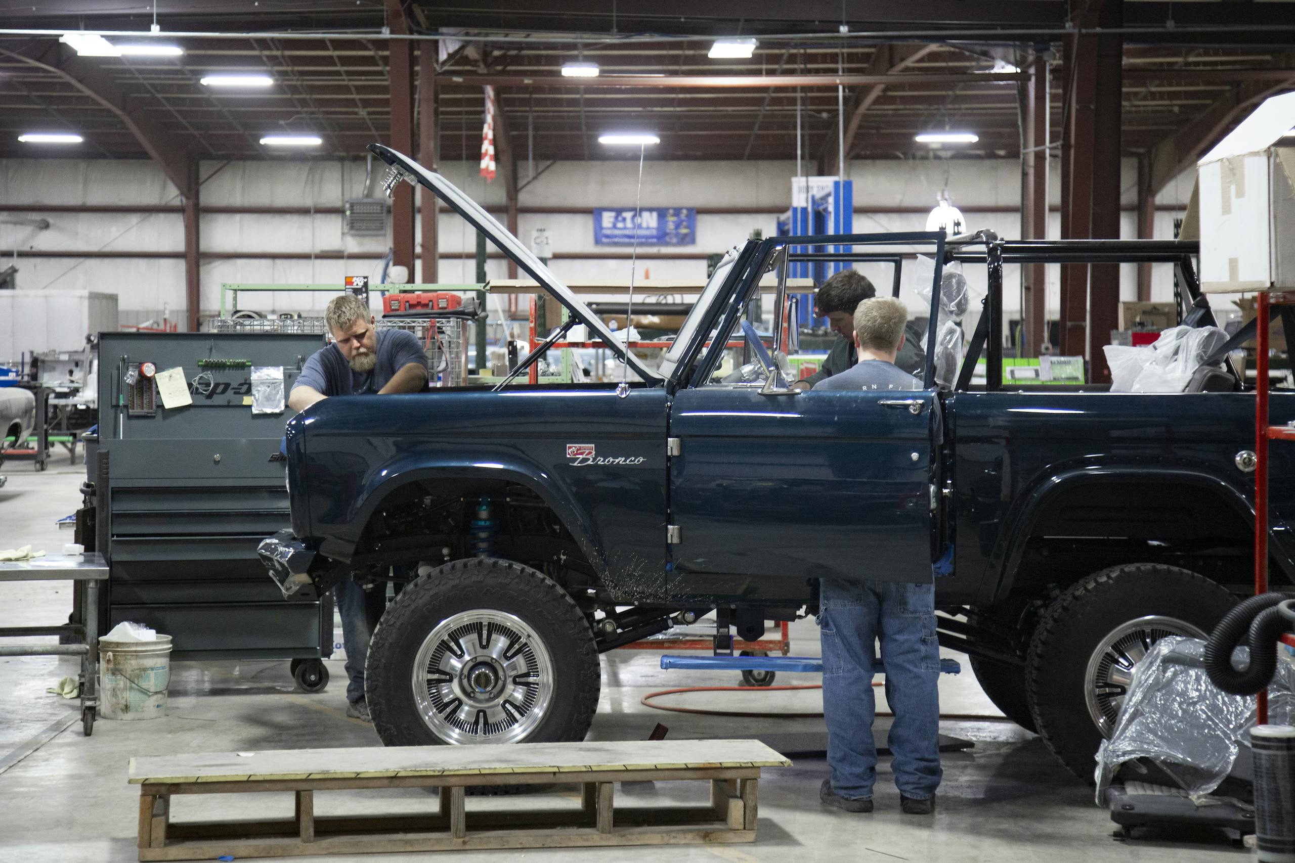 men working inside gateway bronco reimagination facility hamel illinois