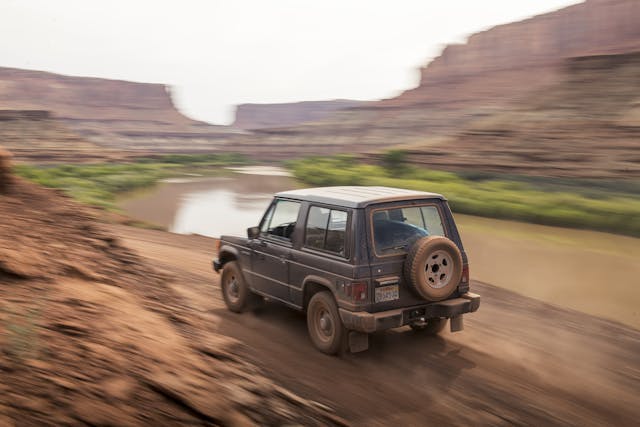 Mitsubishi Montero rear three-quarter dynamic trail action Canyonlands Moab Utah