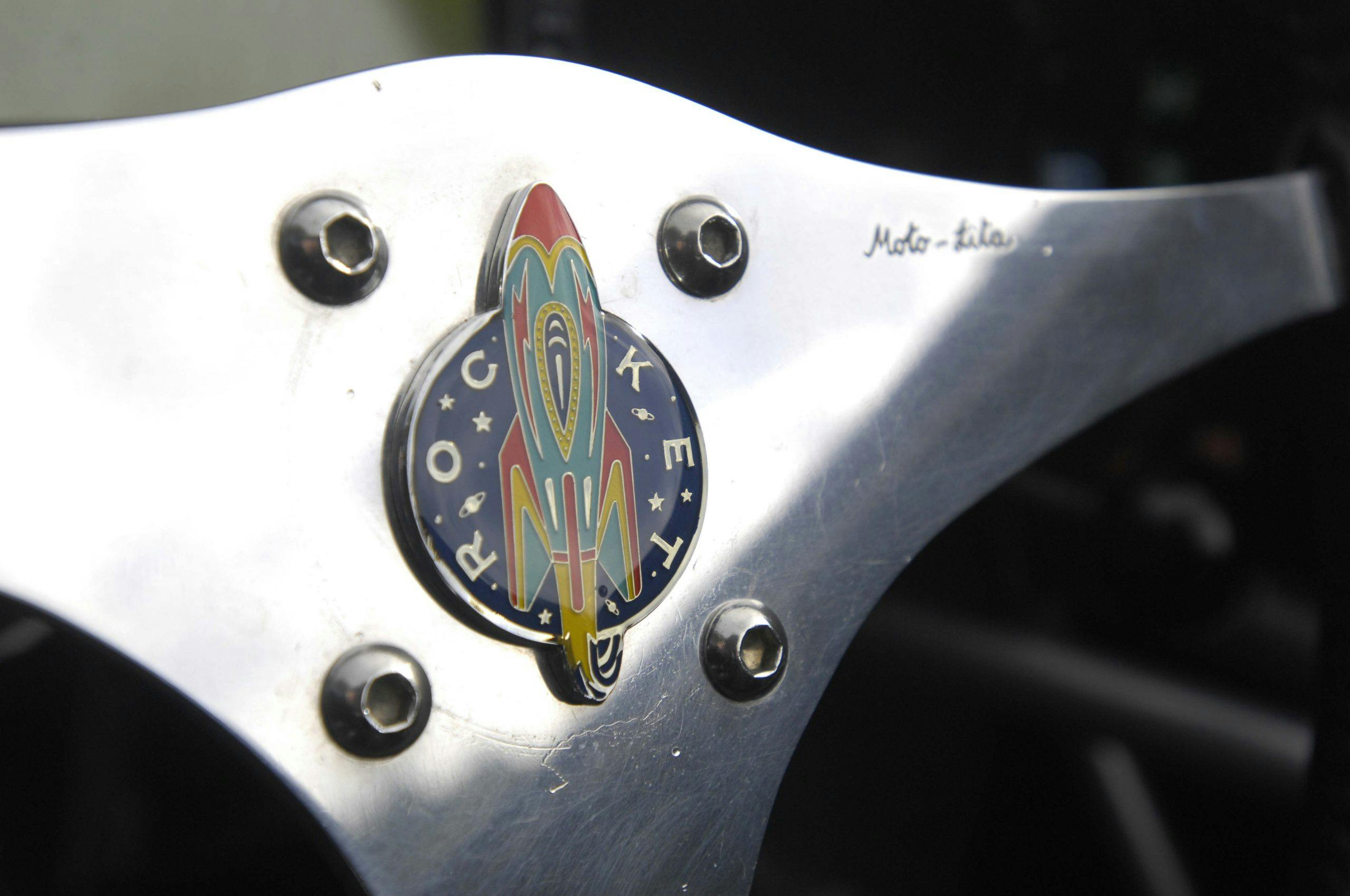 Rocket car steering wheel logo close up