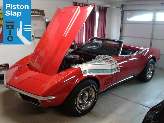 1968 red corvette garaged hood open