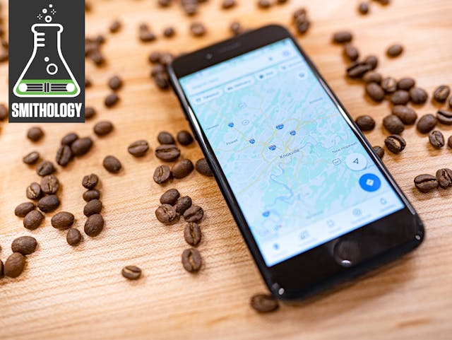 whole coffee beans wood table close up with phone map knoxville