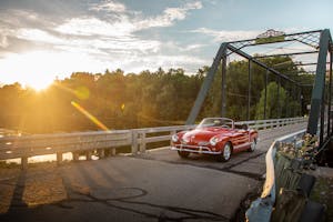 vintage volkswagen karmann ghia bridge crossing action