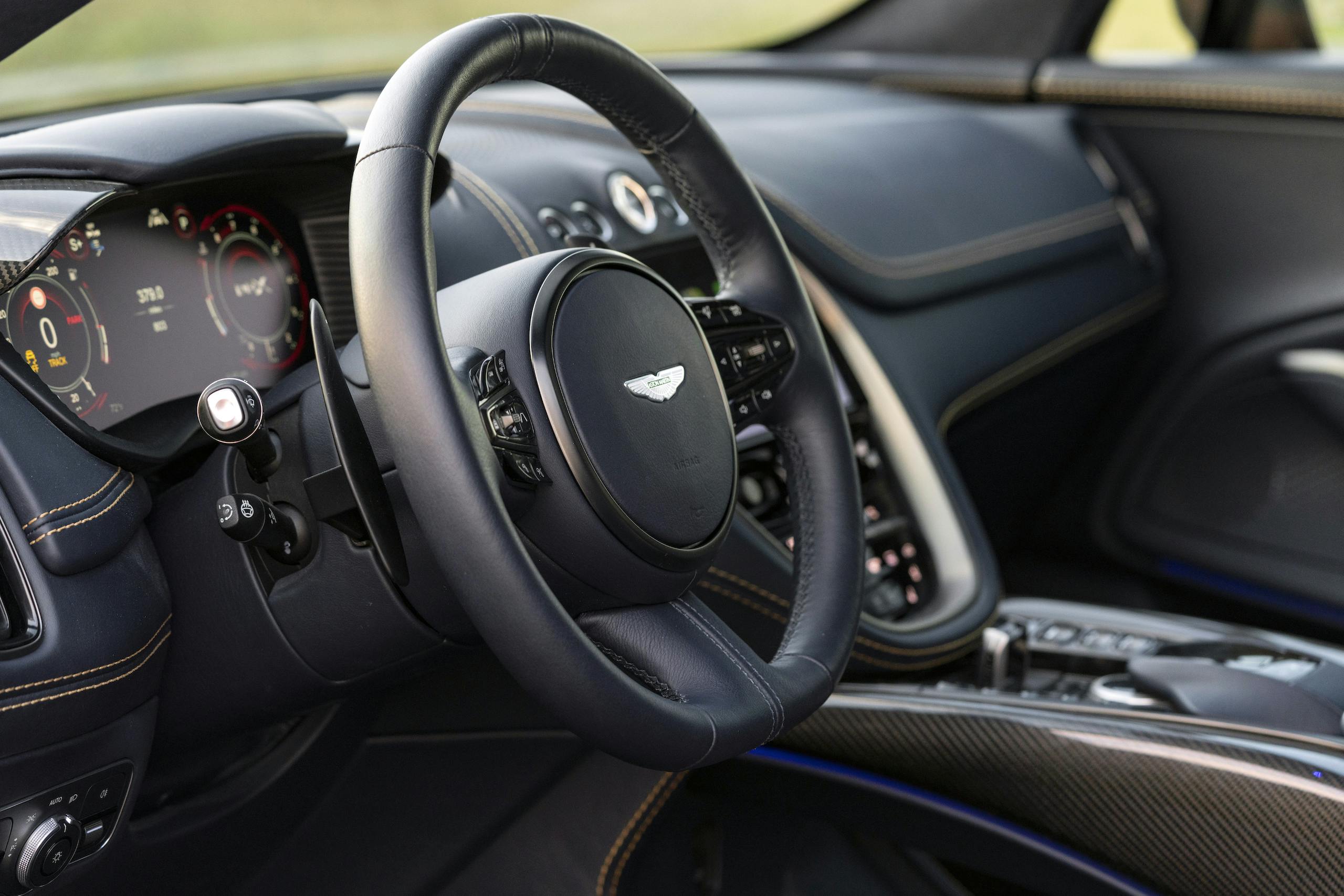 aston martin new dbx suv golden saffron interior steering wheel