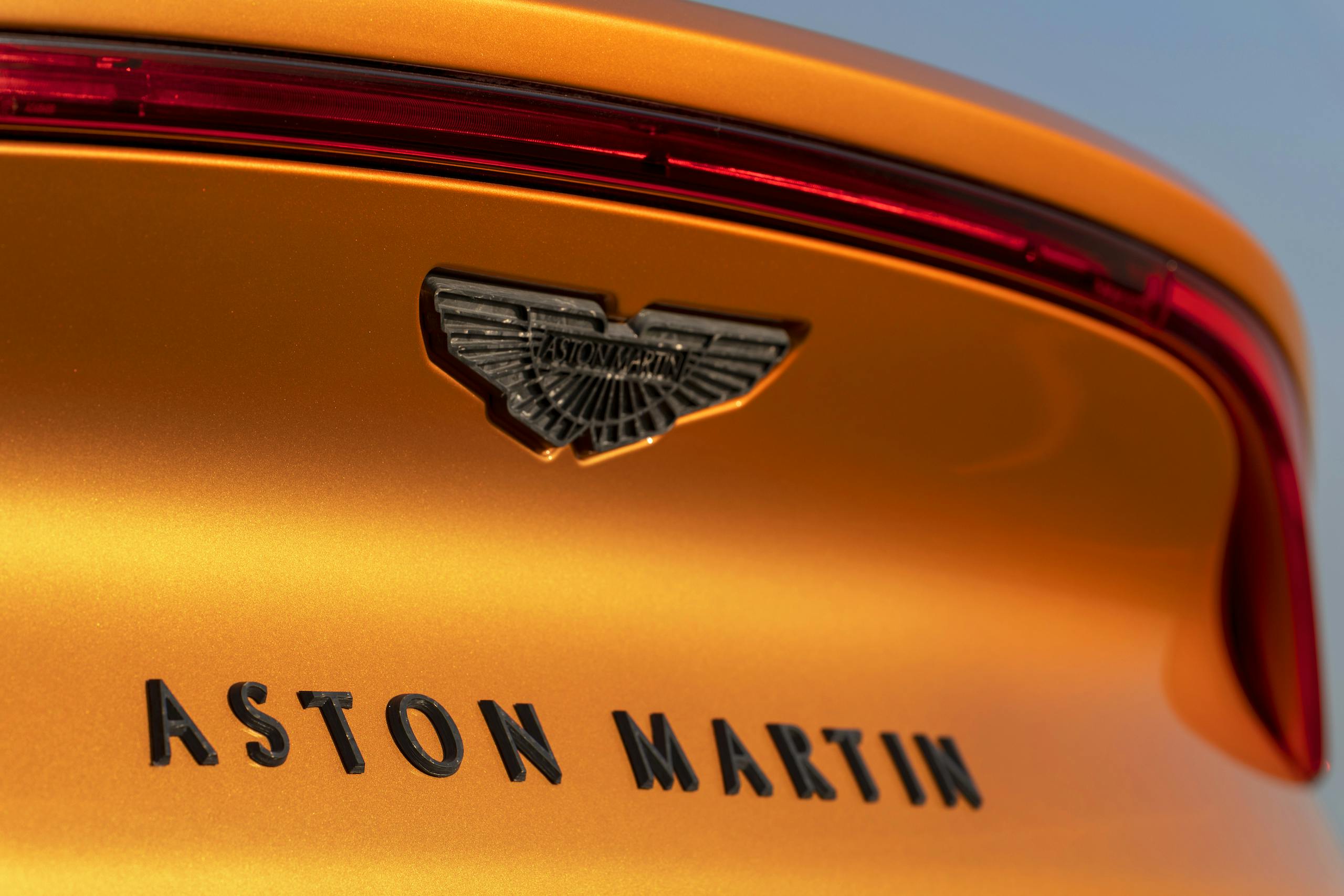 aston martin new dbx suv golden saffron rear badging
