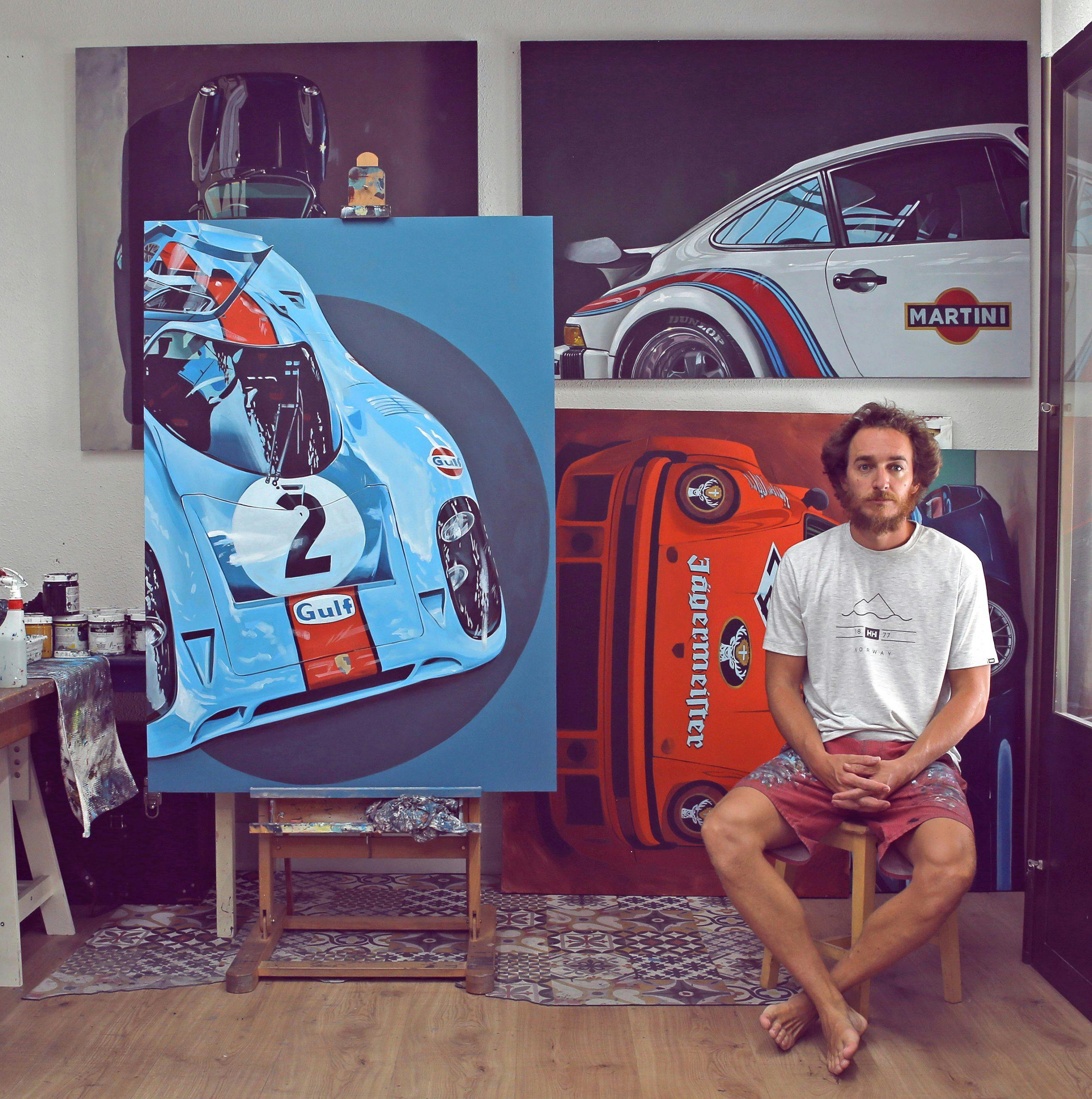 artist manu campa in studio beside gulf livery art painting