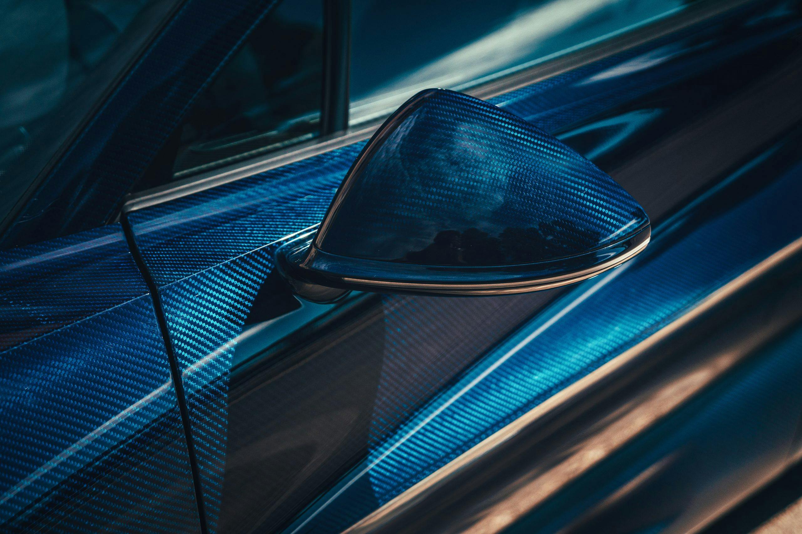 Bugatti Divo blue carbon fiber weave exposed