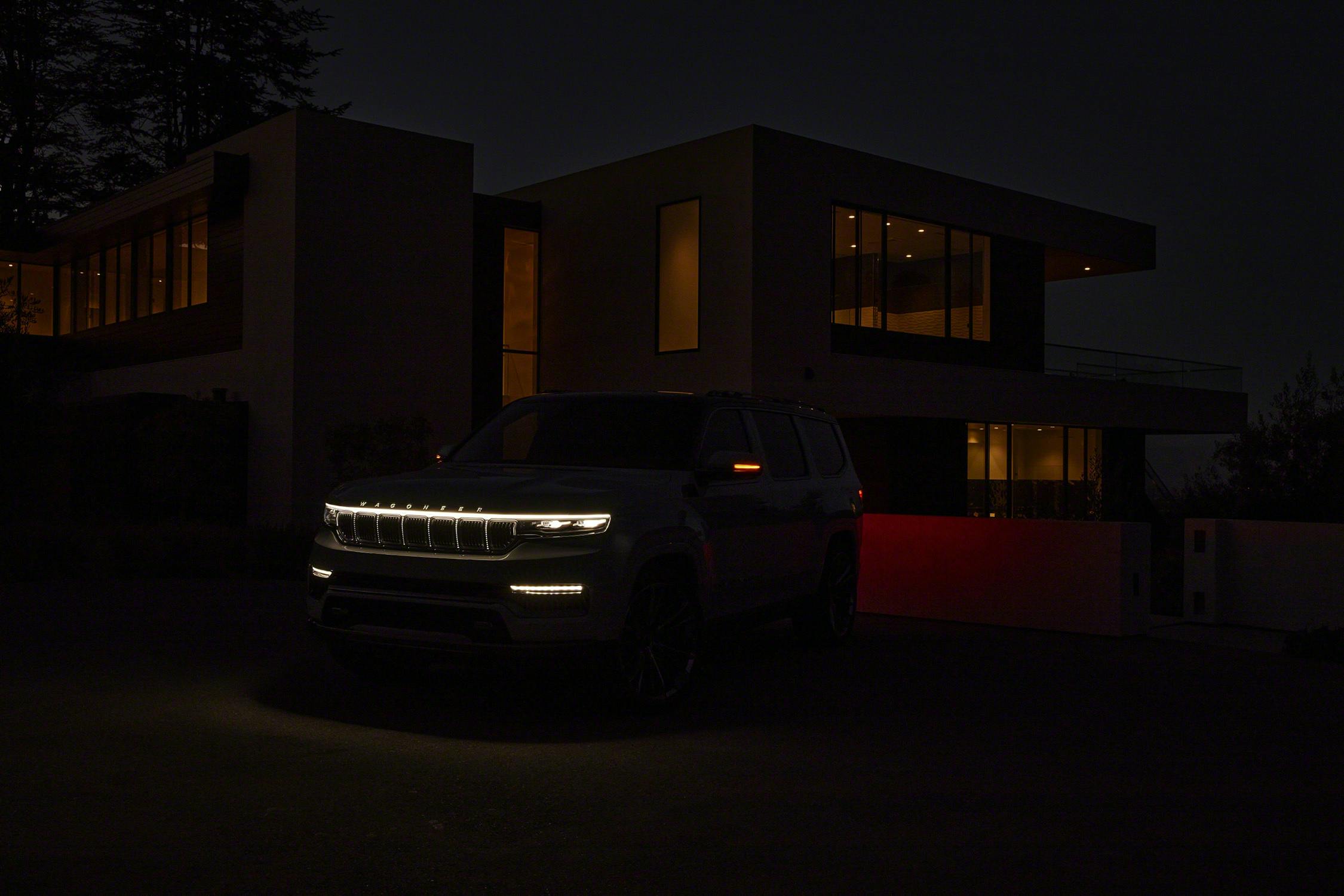 Grand Wagoneer Concept front lighting elements in dark in front of house