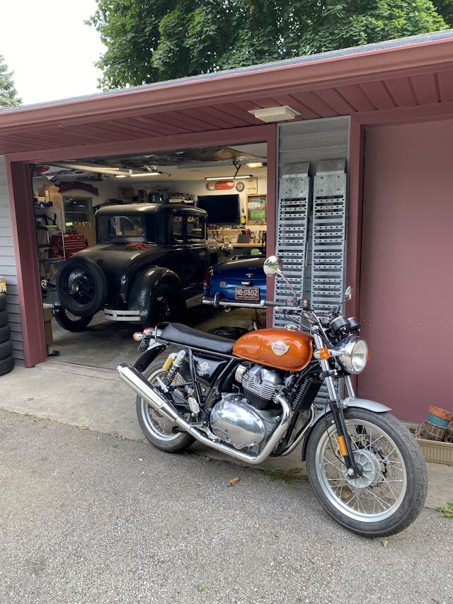 Royal Enfield INT650 in front of garage