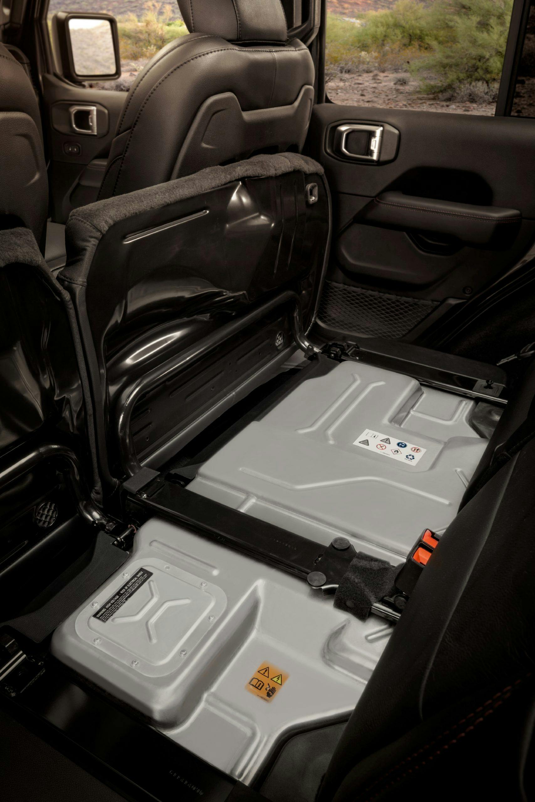 The Jeep® Wrangler 4xe's 400-volt, 17kWh battery pack mounts beneath the second-row seat, where it is protected from outside elements.