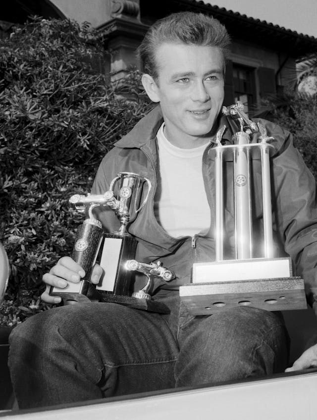 James Dean Holding Trophies for Racing
