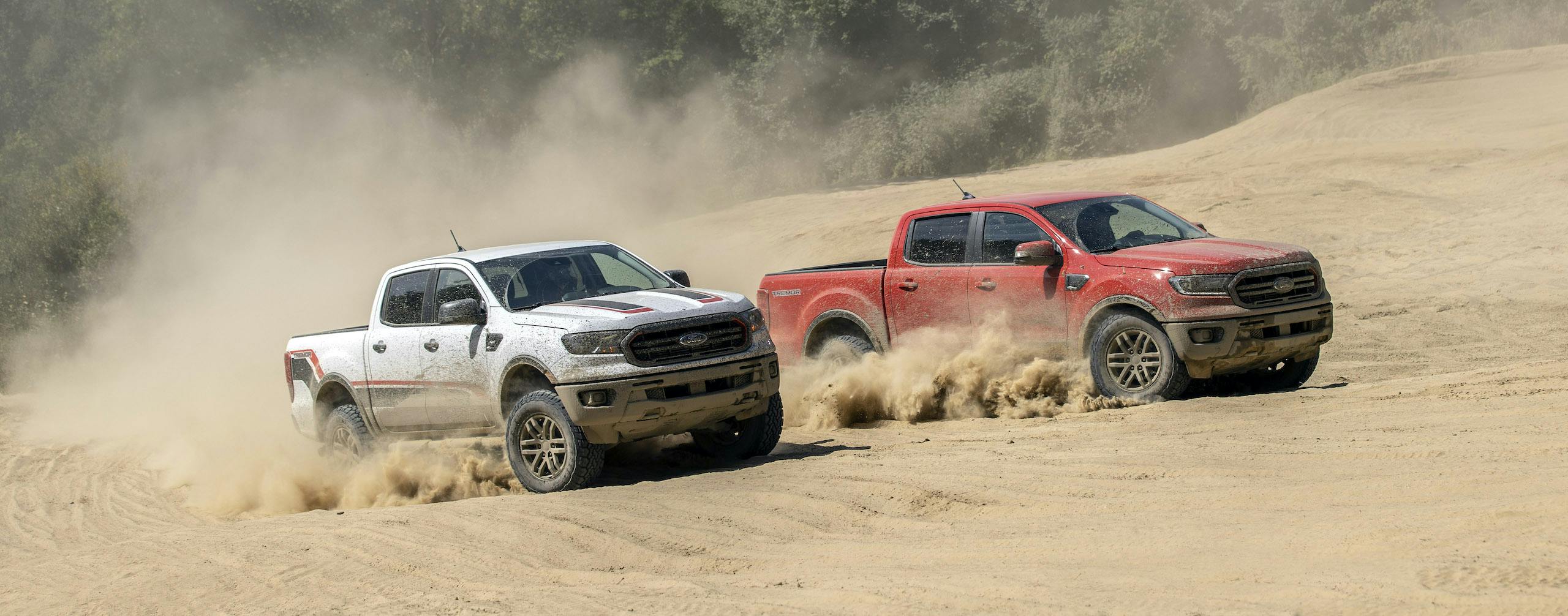 Ranger Tremor XLT and lariat front three-quarter off road dune sand action