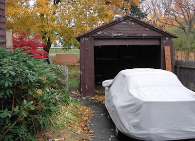 old garage and 911SC under car cover