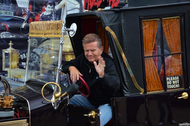 former child actor Butch Patrick at wheel of munster koach