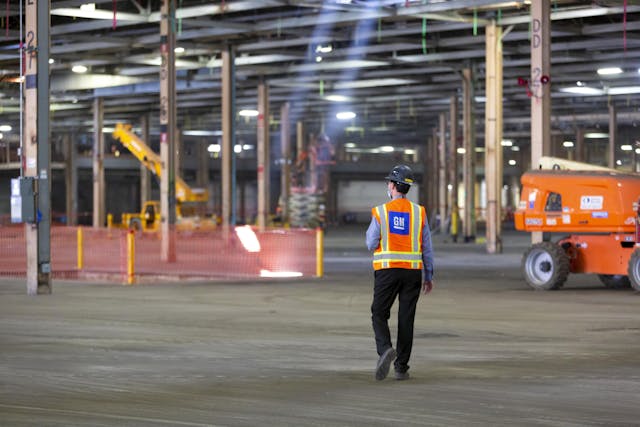 factory zero plant worker walks interior