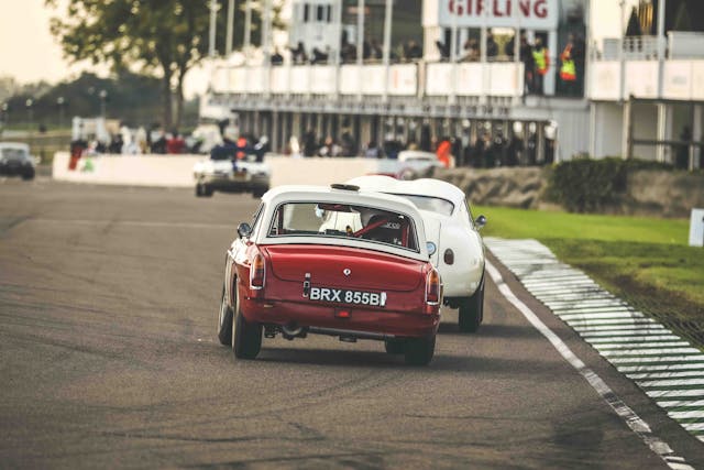 goodwood speedweek two tone red white coupe rear racing action