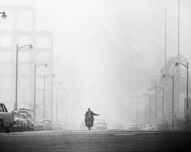 Motorcyclist Surrounded by Smog