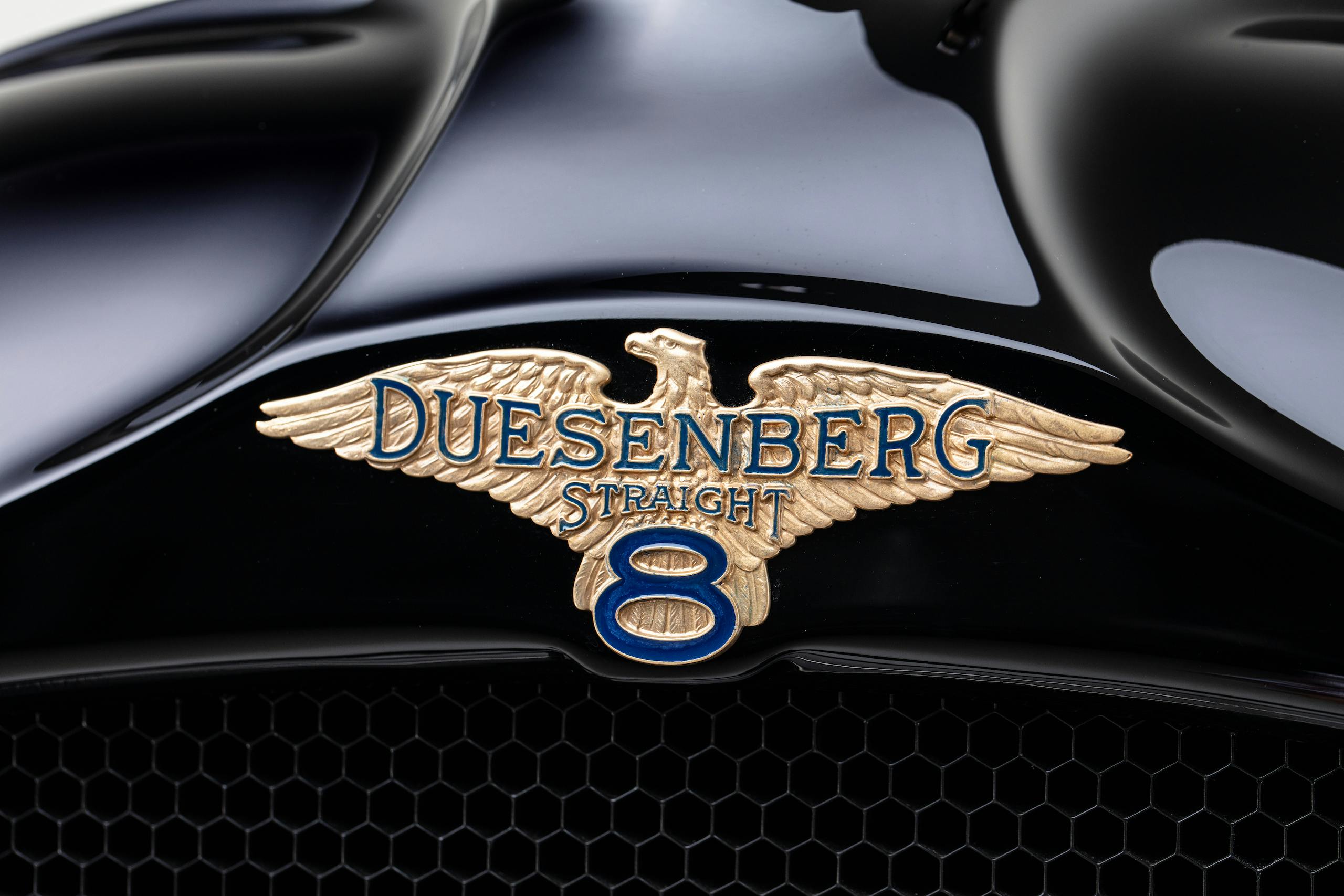 Duesenberg straight eight logo icon ornament close