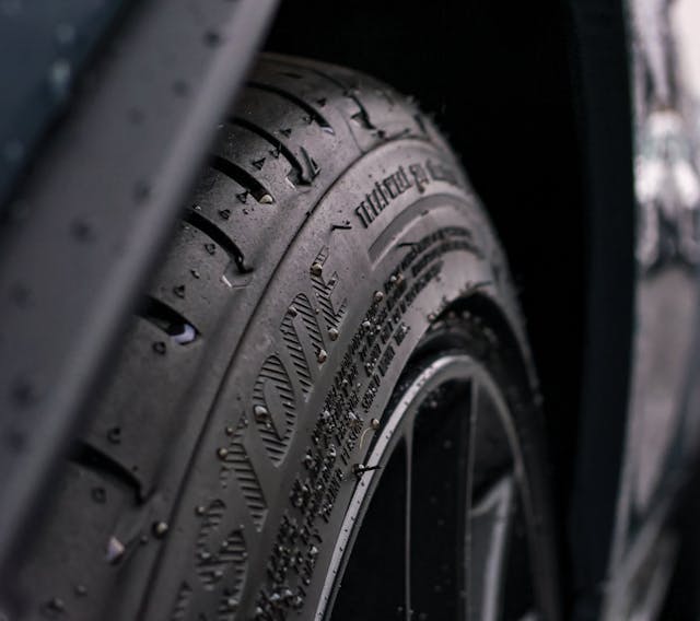 car tire rain droplets on rubber