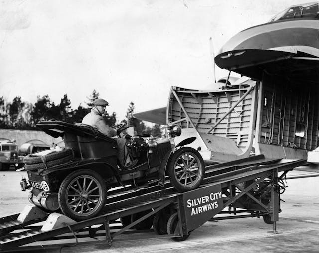 Old motor car being loaded on to Silver City Airways aeroplane