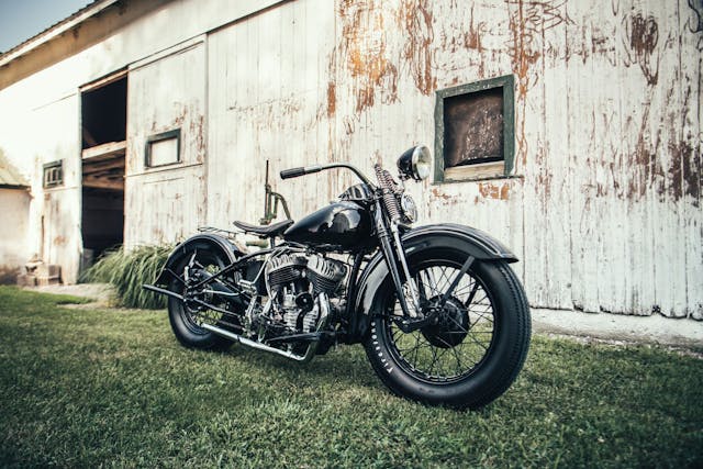 Harley Davidson motorcycle by a barn