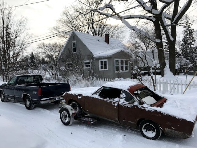 1965 Chevrolet Corvair getting hauled off for scrap