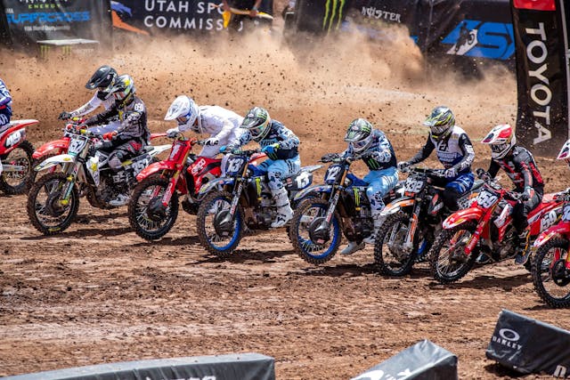 Supercross riders shoot from starting gates action