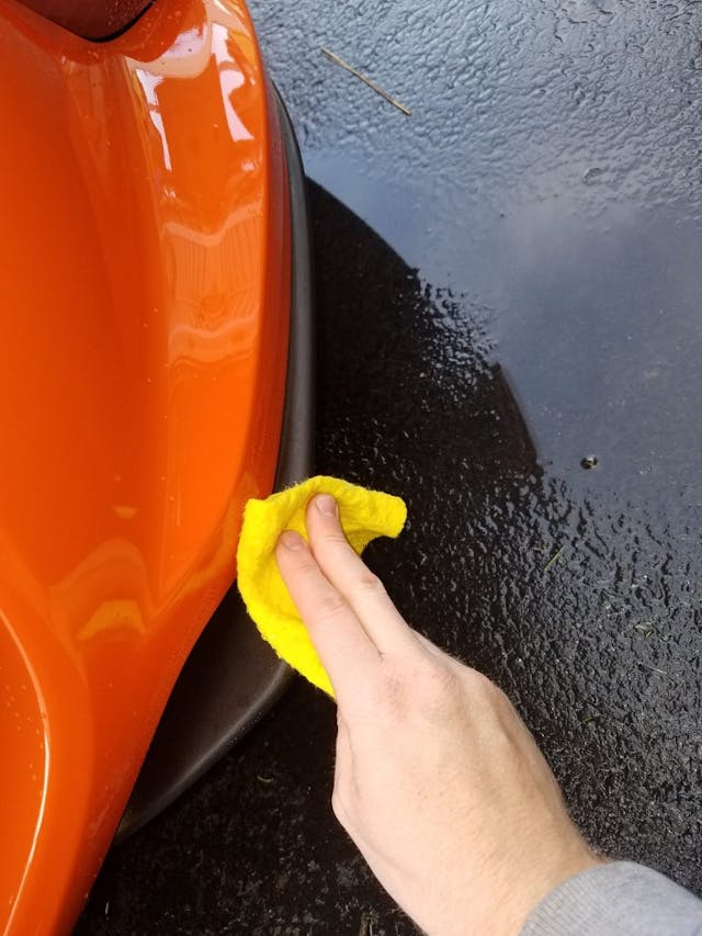 Cleaning plastic moldings on car