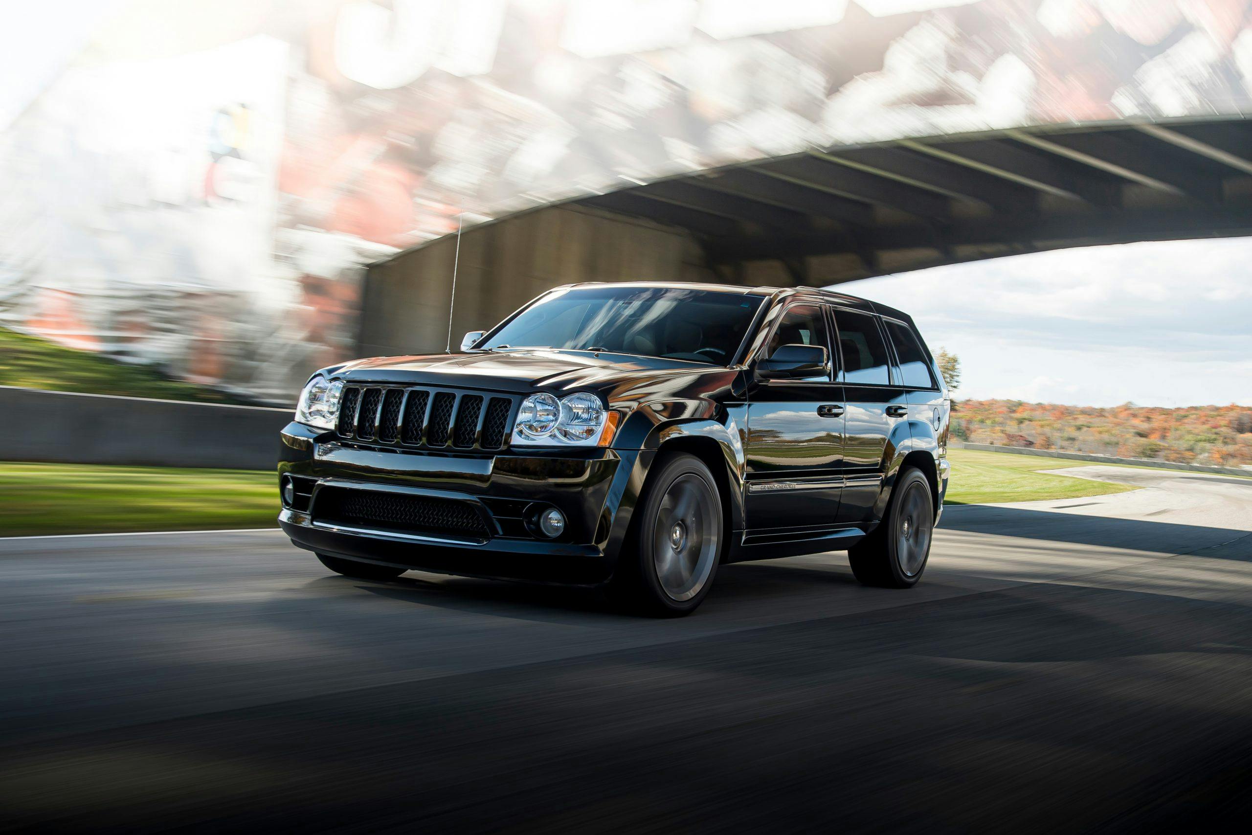 Jeep Grand Cherokee SRT8 front three-quarter dynamic on track action